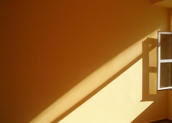 Clean minimalist interior with soft shadows and calm atmosphere